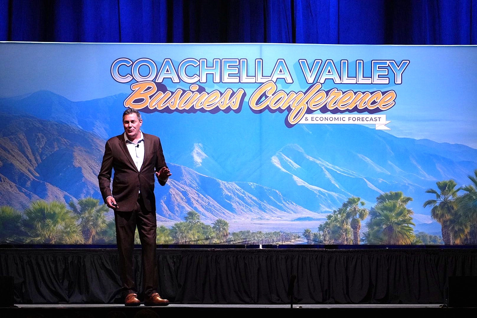 Greater Palm Springs economic presentation - Thornberg photo on stage